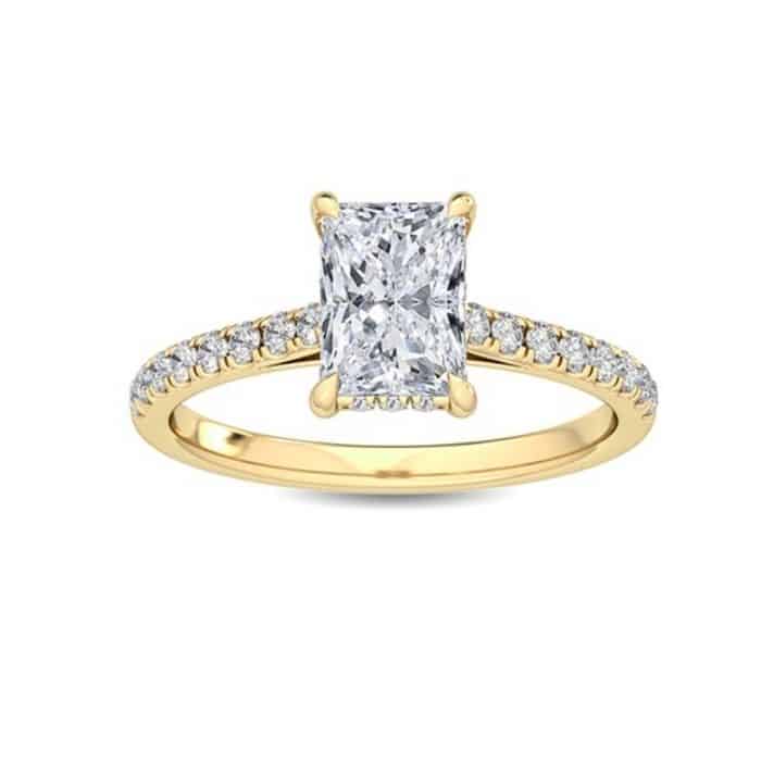 Radiant cut diamond shoulder hidden halo engagement ring by the Diamond Ring Company yellow gold
