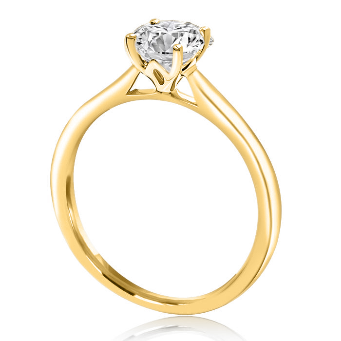yellow gold engagement ring with lotus flower in-between claws