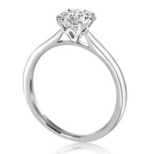 four claw solitaire engagement ring with lotus flower detail