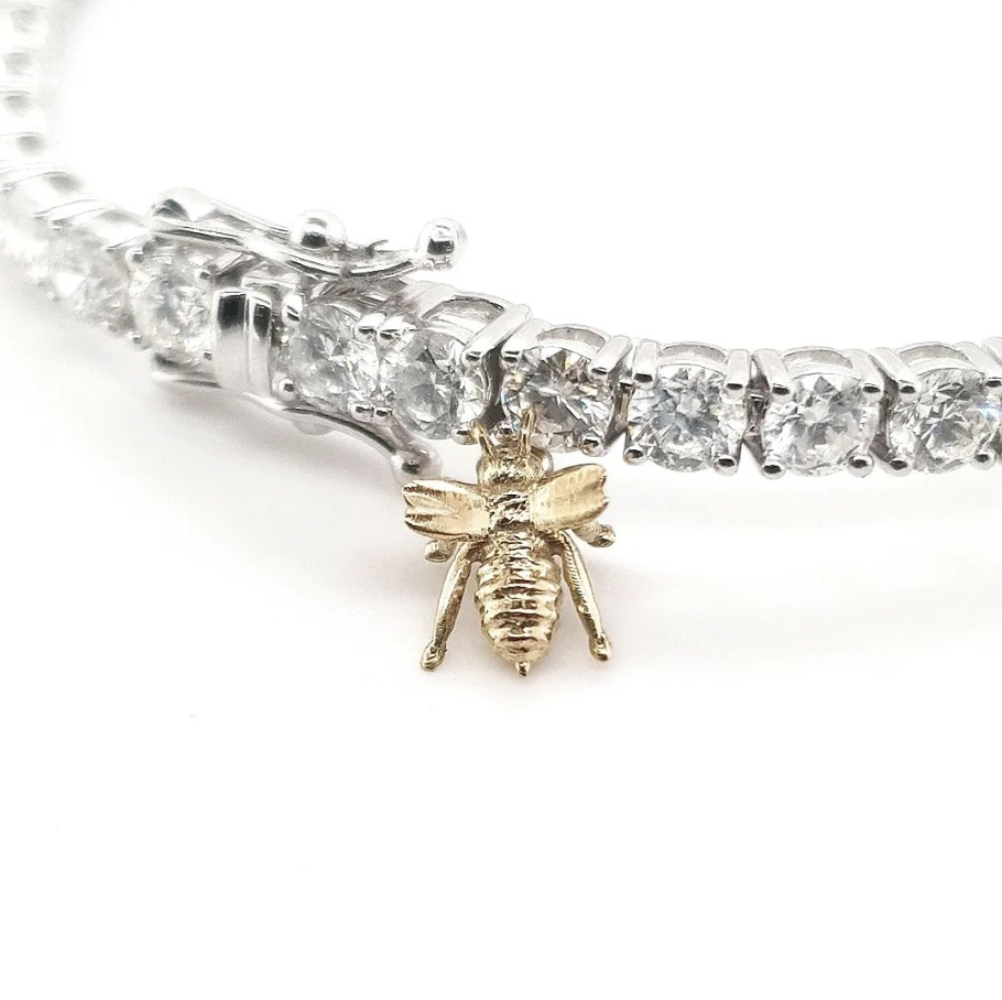 Tiny Yellow Gold Bumble Bee attached to a Tennis bracelet