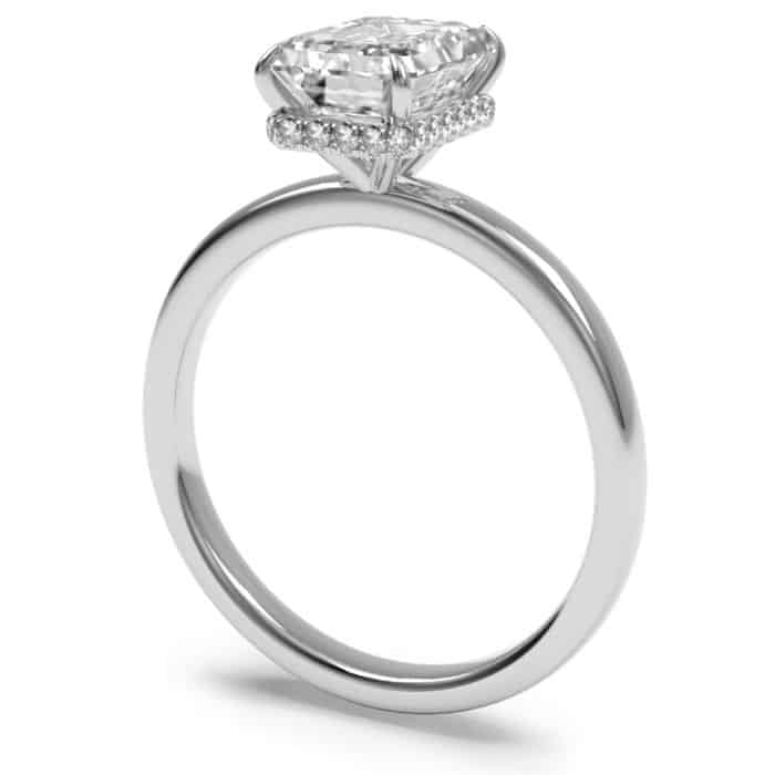 Platinum diamond hidden halo engagement ring with with an emerald cut centre stone