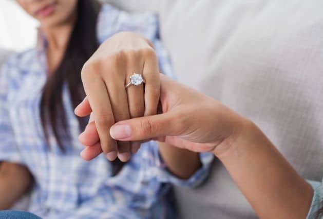 Lady showing off a 3ct engagement ring