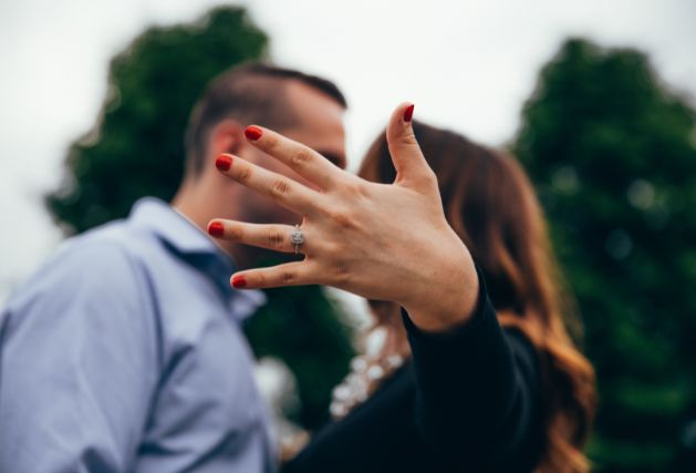 Lady showing off her ring right after her proposal