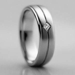 Mens platinum single diamond wedding band with a brushed finish and score line