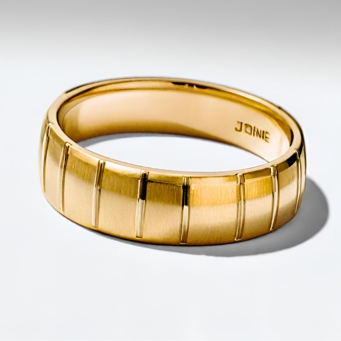 Mens platinum striped wedding band with brushed finish in yellow gold