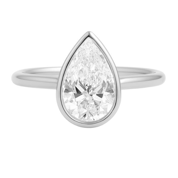 Bezel set diamond engagement ring with a pear brilliant cut diamond in platinum