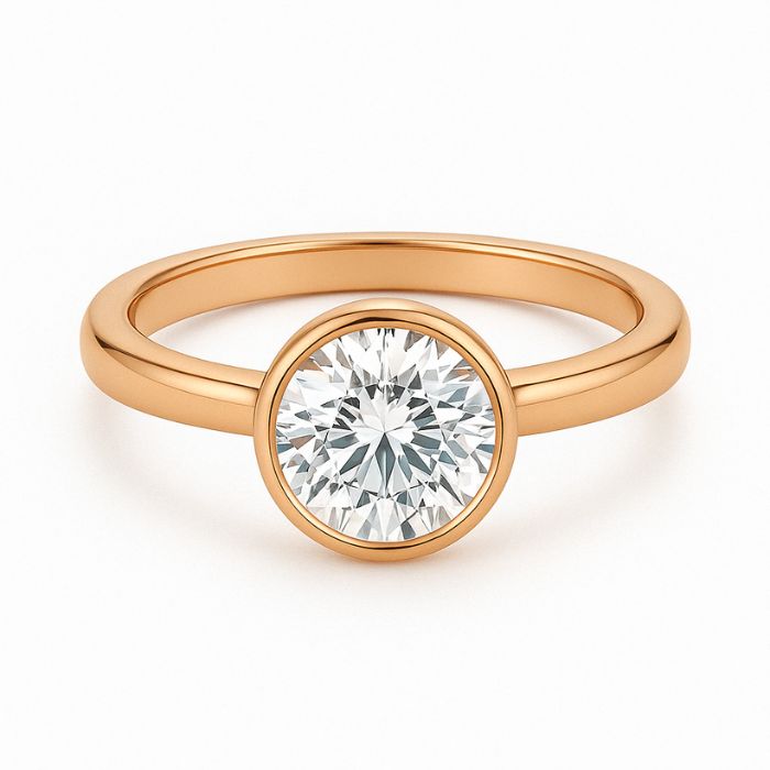 Bezel set diamond engagement ring with a round brilliant cut diamond in rose gold
