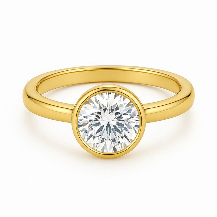 Bezel set diamond engagement ring with a round brilliant cut diamond in yellow gold