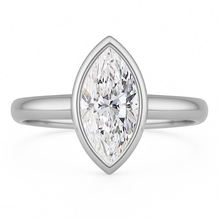 Bezel set diamond engagement ring with marquise diamond in platinum
